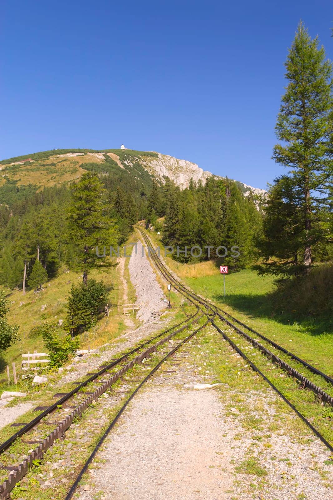 Mountain view with cogwheel railway (Mountain named Schneeberg, Austria). Vertically.