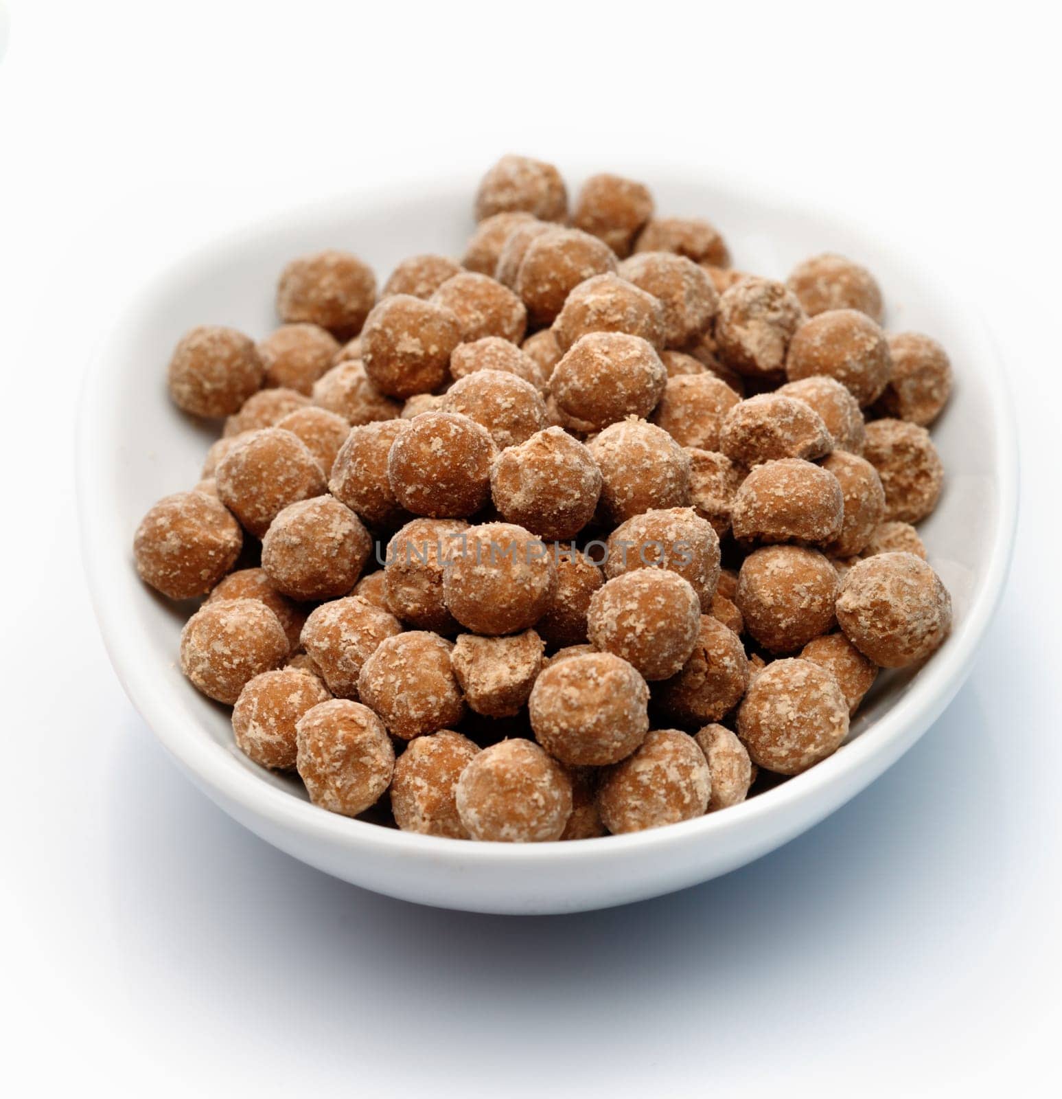 Raw Tapioka pearls in a bowl isolated on white background. As Bubble Tea ingredient.