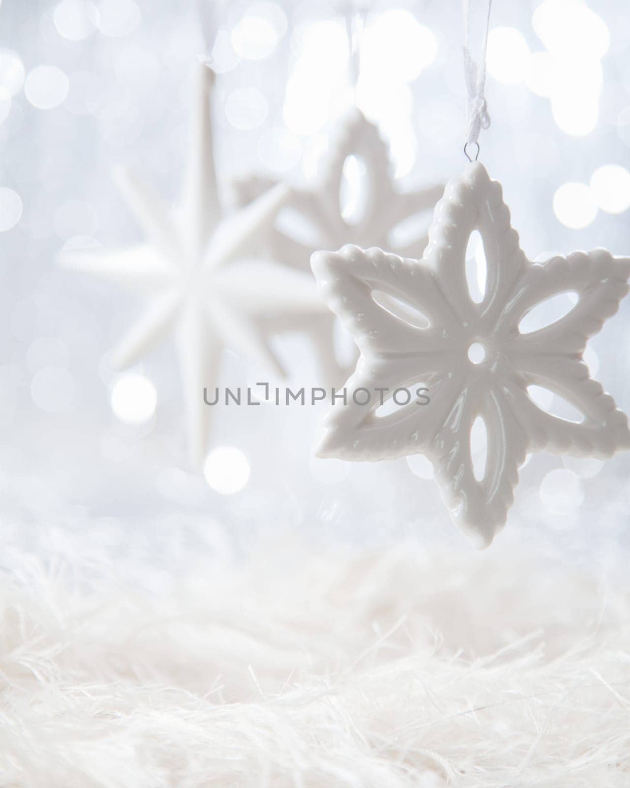 Bright Christmas stars on white boketh background