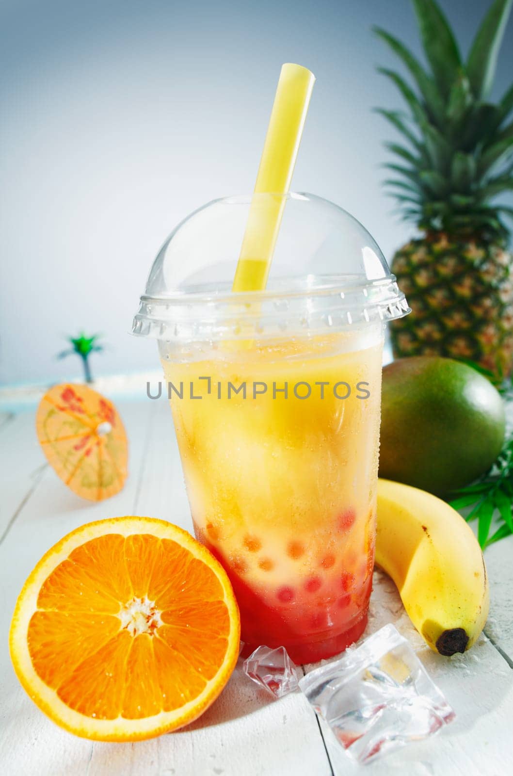 Healthy bubble tea tropical fruit smoothie with banana, mango, pineapple and orange blend