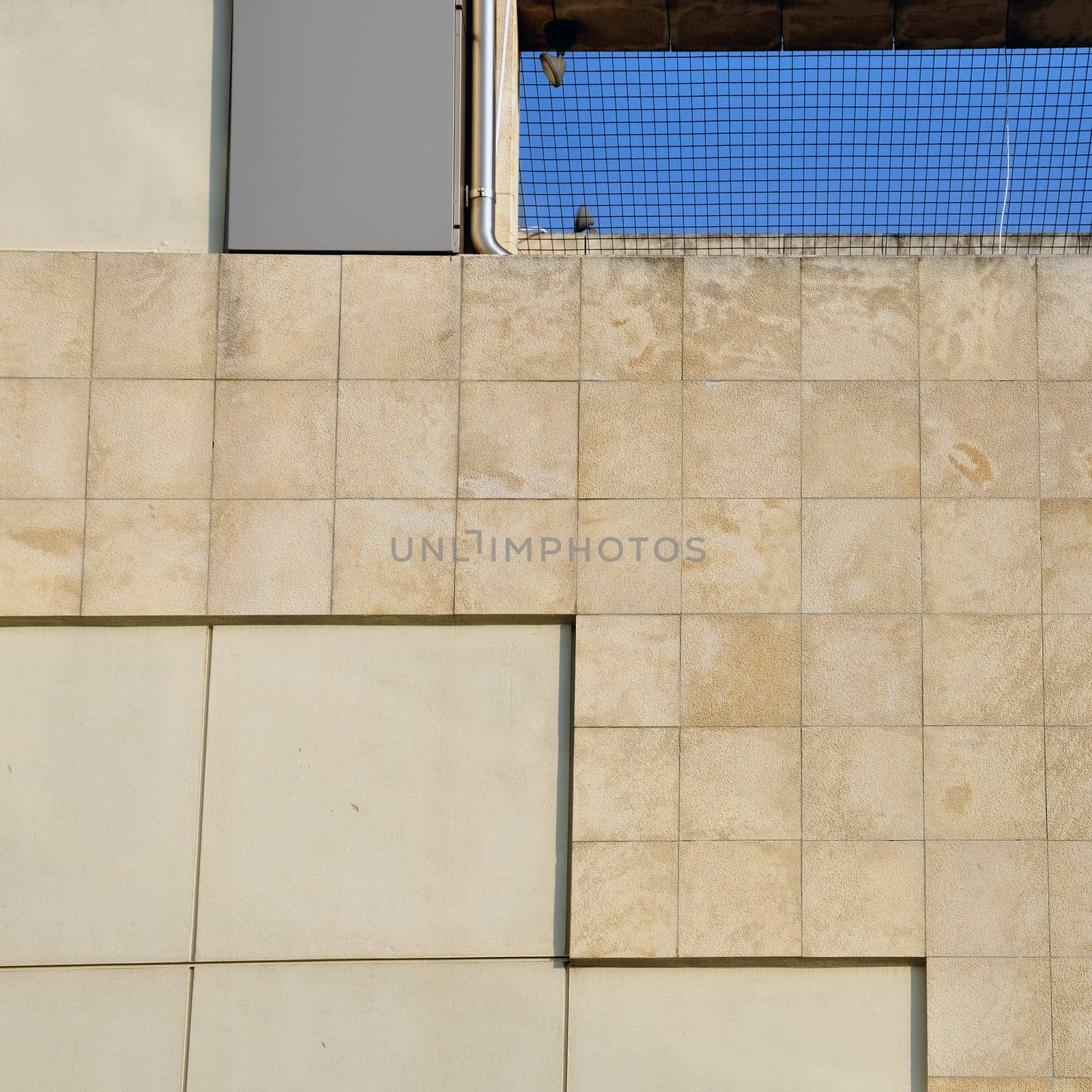 Wall and sky architectural background. Modern building facade detail.