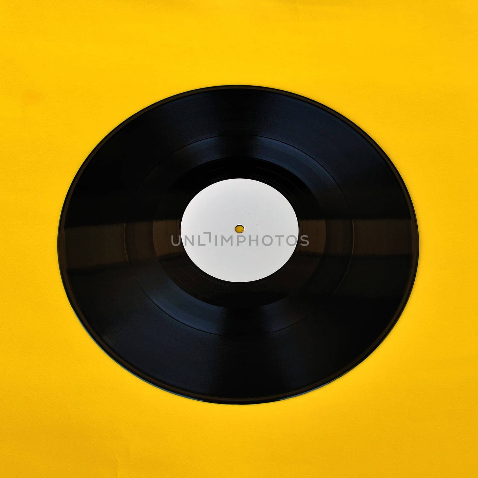 Vinyl record white label promo on yellow background. Music and audio.