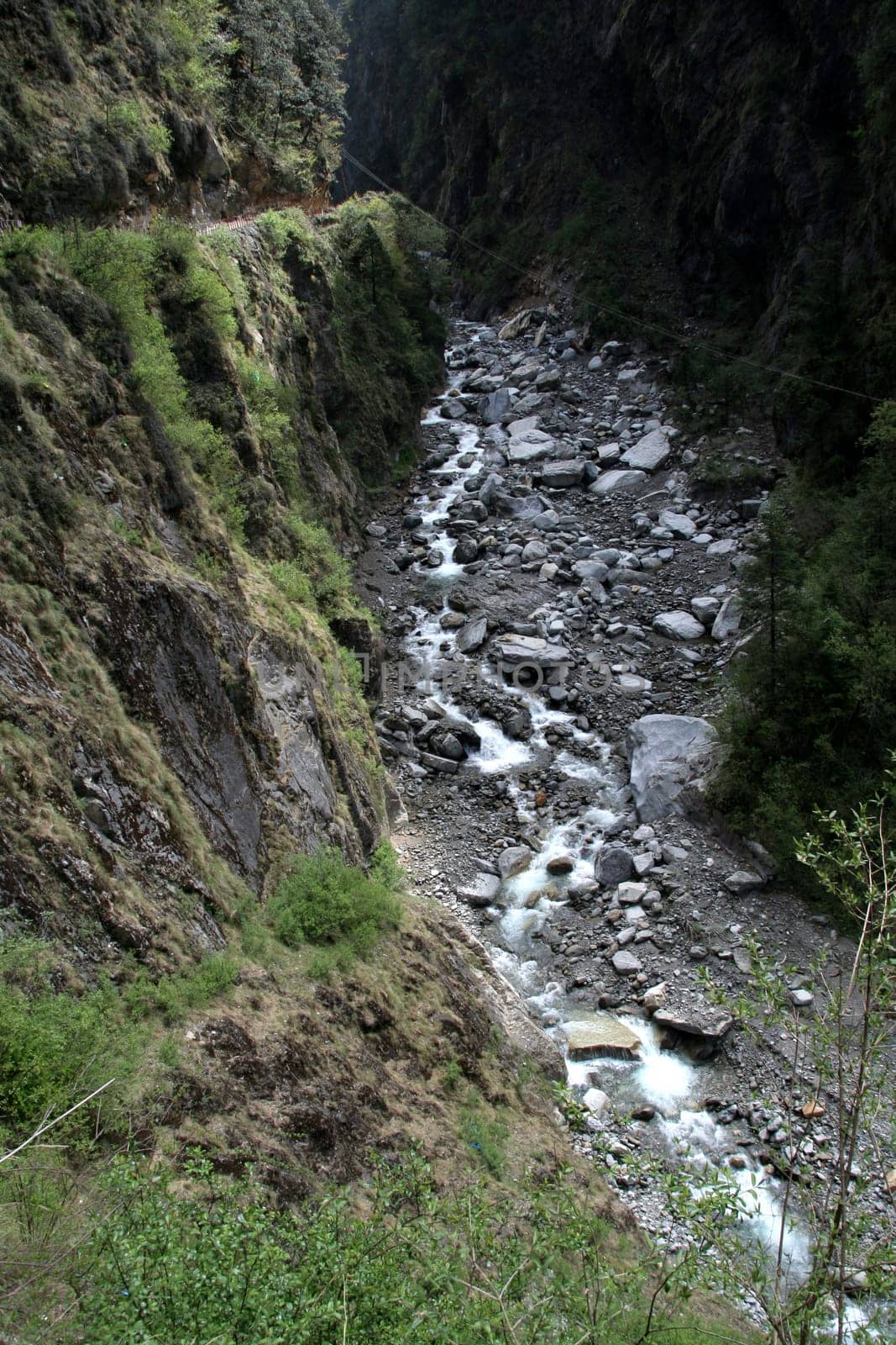 Thin current of water at the source in Yamuna River valley, India, Asia