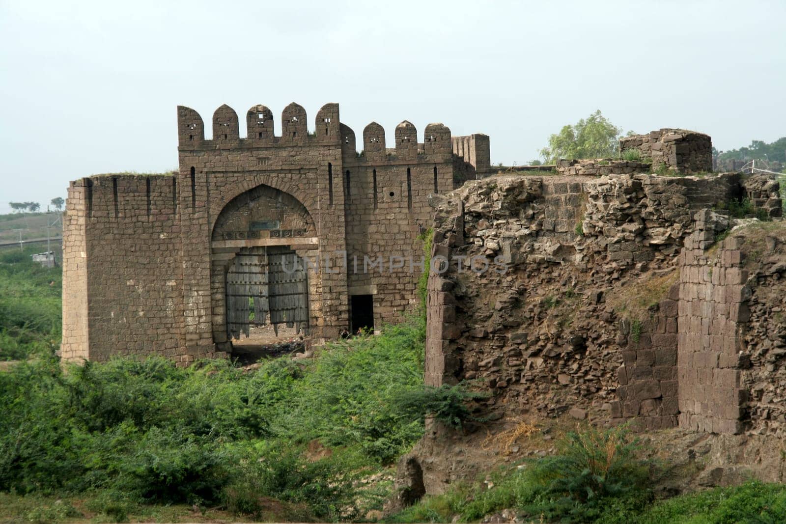Gate in fort wall of historical city Bijapur, Karnataka, India, Asia