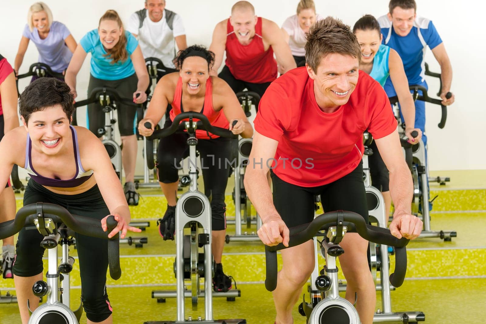 Spinning class sport people exercise at gym enjoy workout