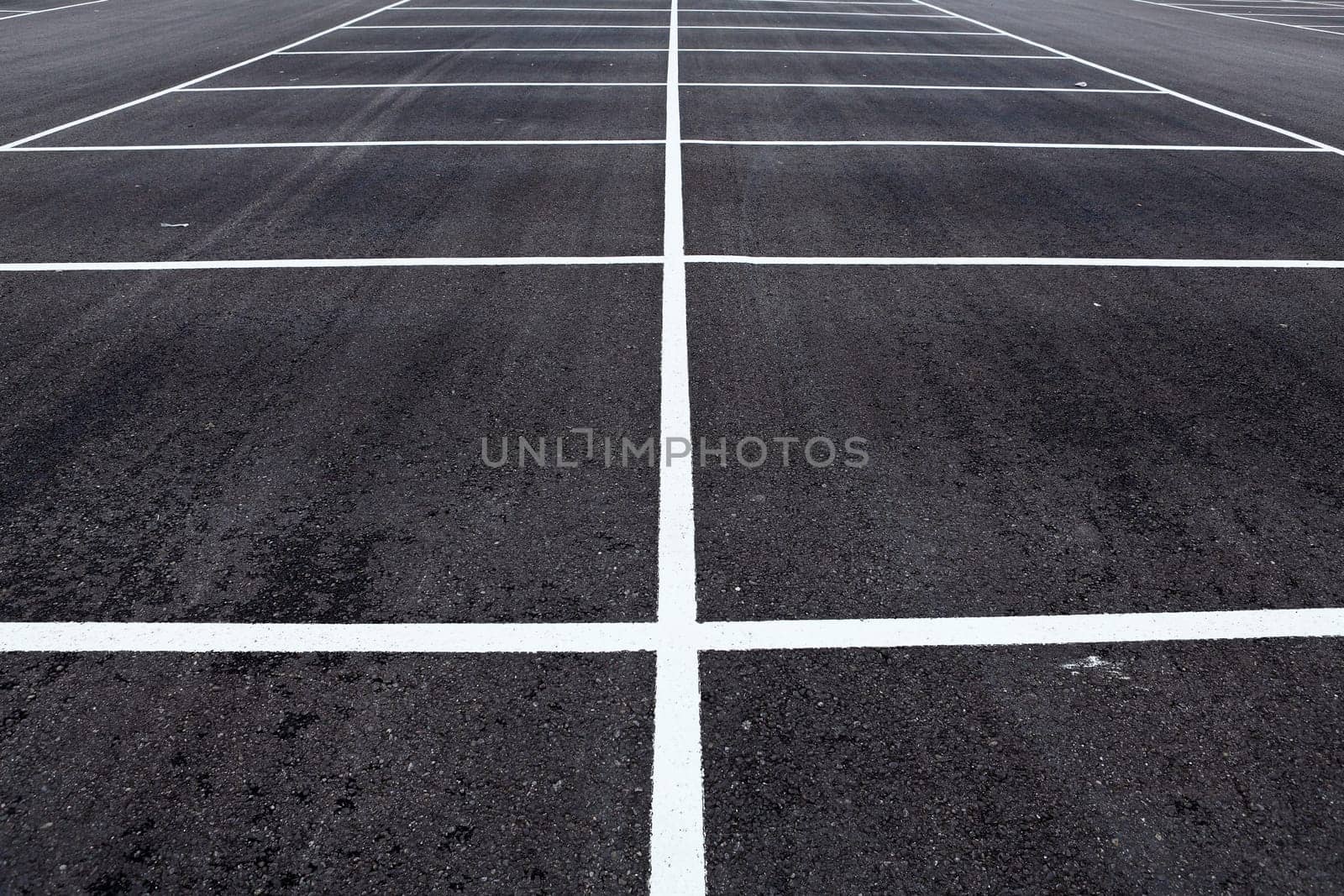 Diagonal view of a large new empty parking area