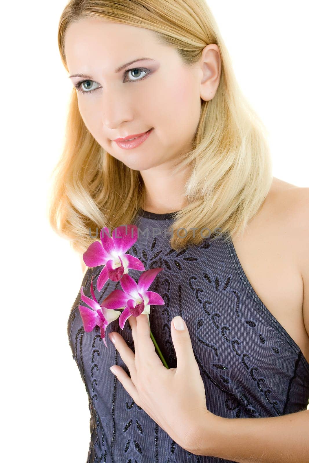 Portrait of a beautiful young woman with orcgid on white background