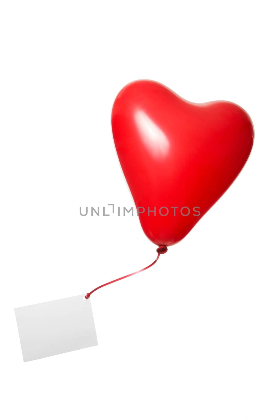 Red heart balloon with greeting card on ribbon