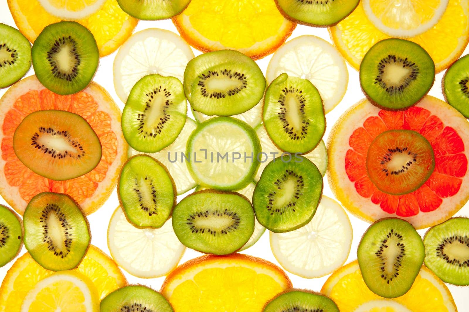 Colorful background of different fruit slices