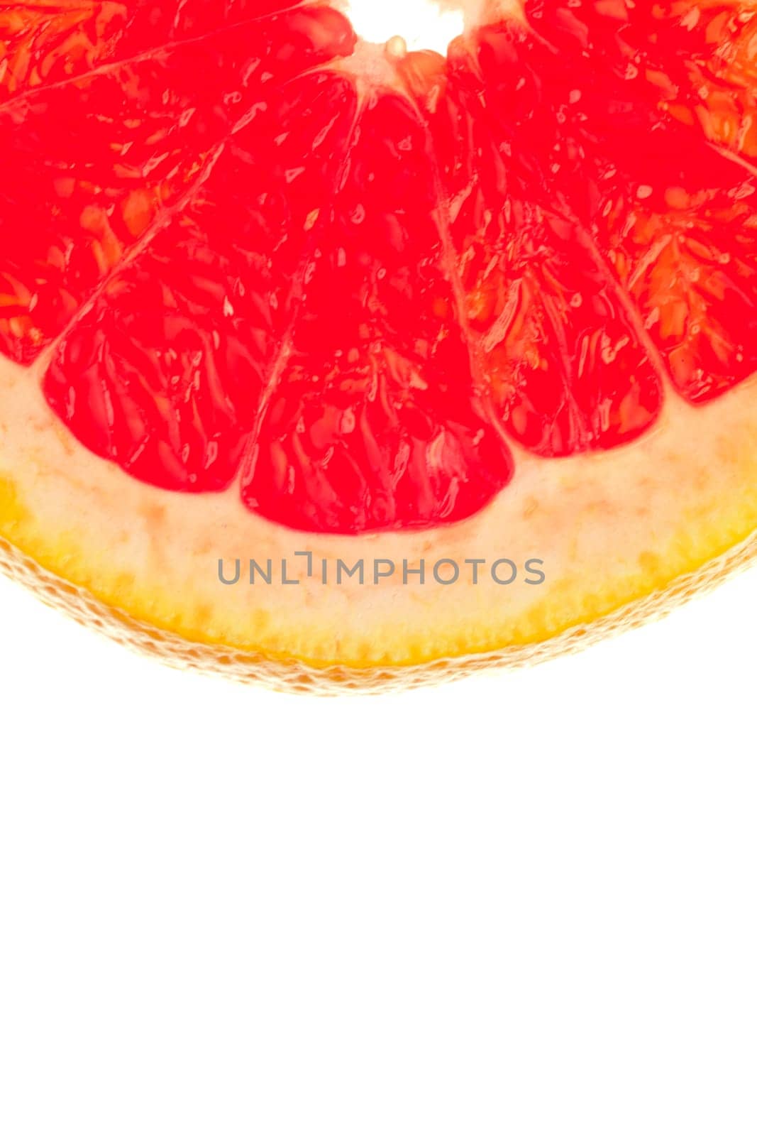 Macro shot of a quarter slice of grapefruit