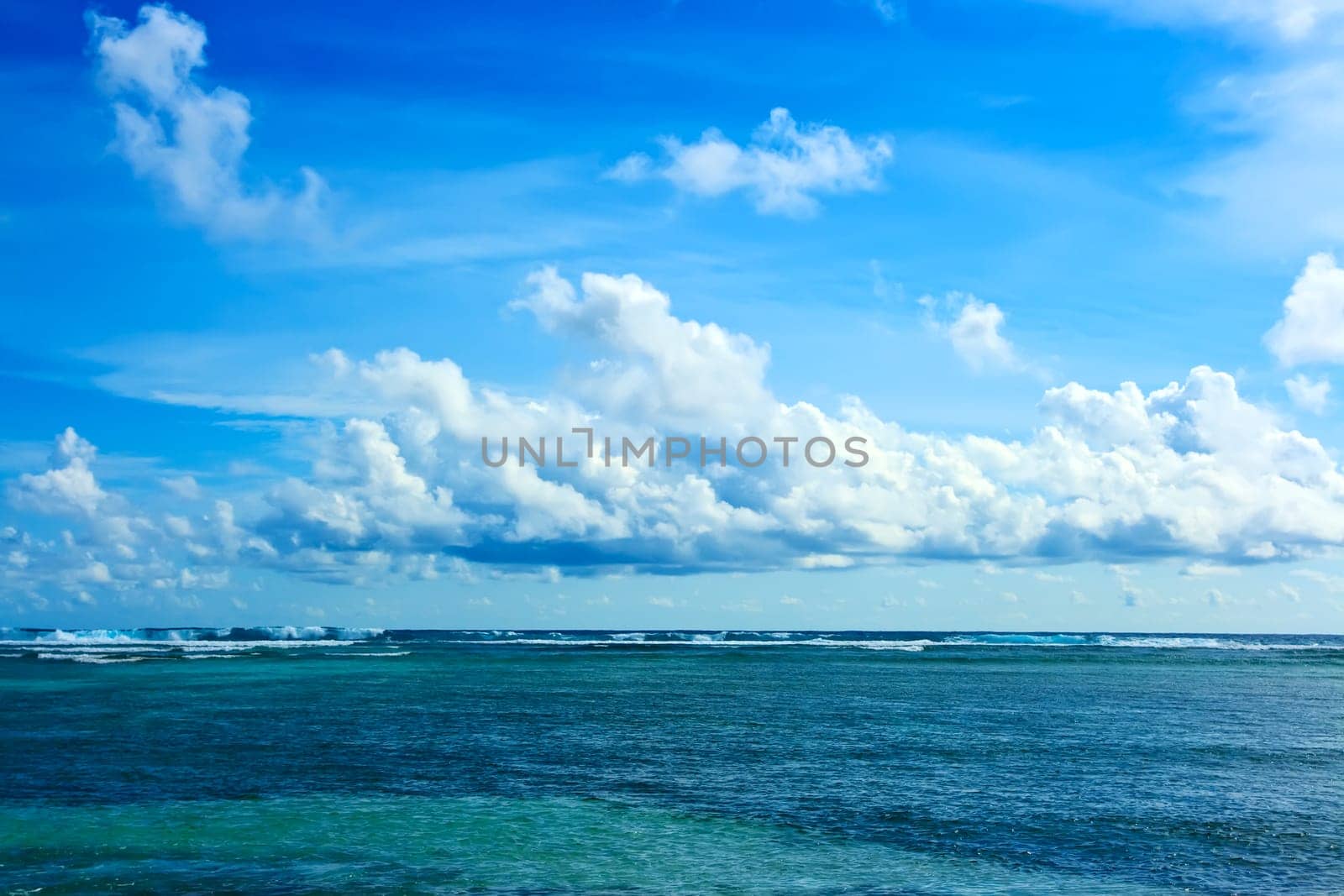 Tropical landscape. Infinity ocean and cloudy sky