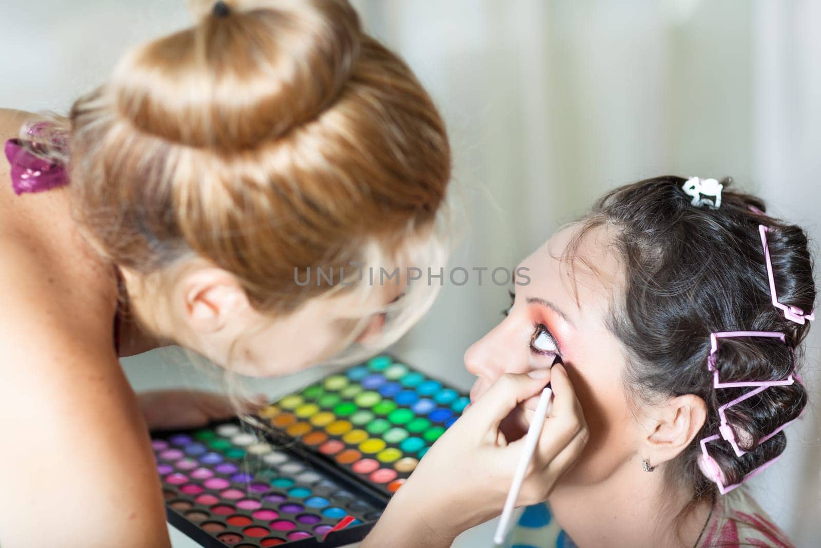 Woman in beauty salon reading for make-up