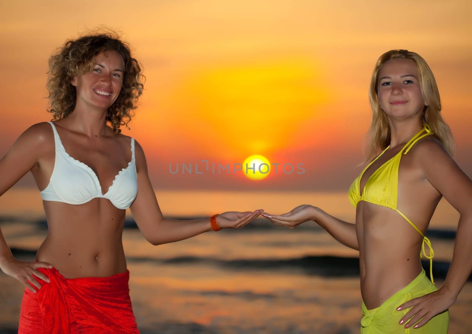Two young woman at sunrise time