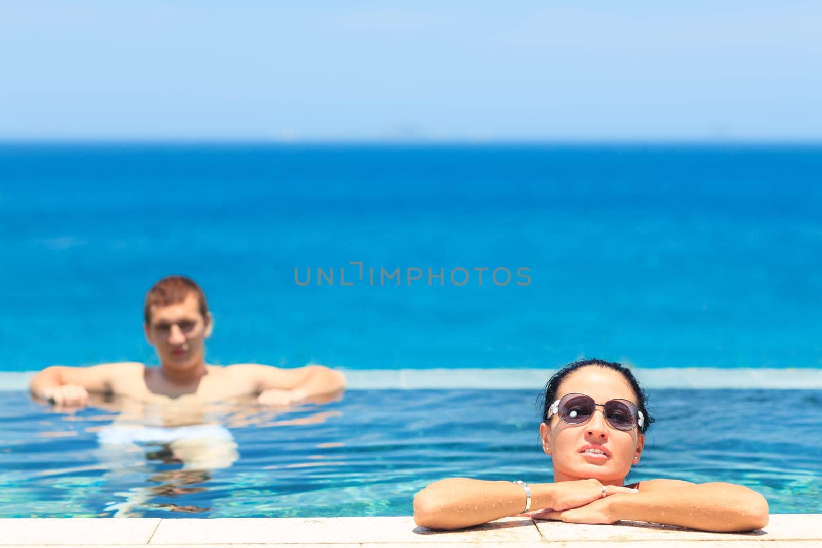 Young couple in swimming pool