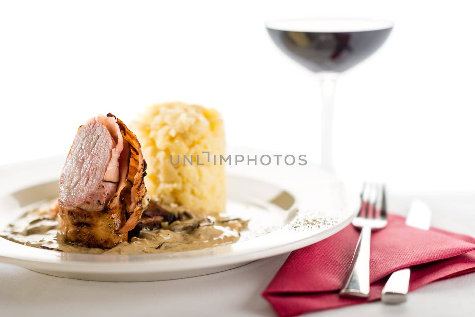 Delicious sirloin steak with mushroom and mashed potatoes and red wine
