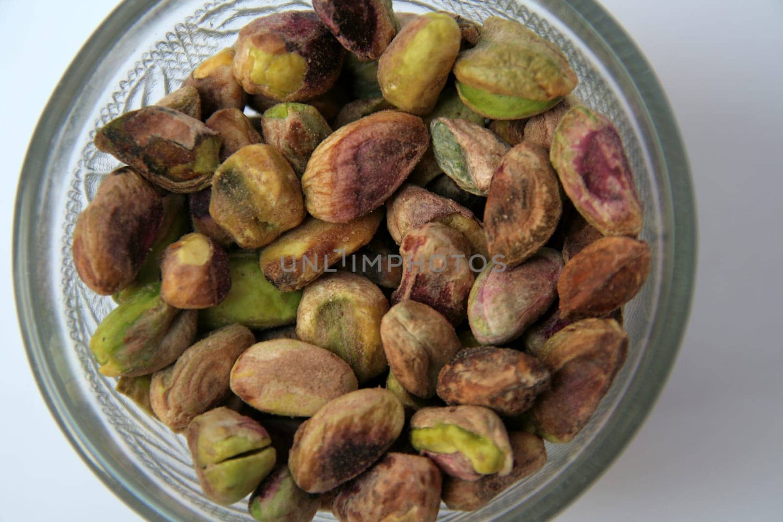 Healthful, edible, pale green seeds of evergreen tree pistacia vera