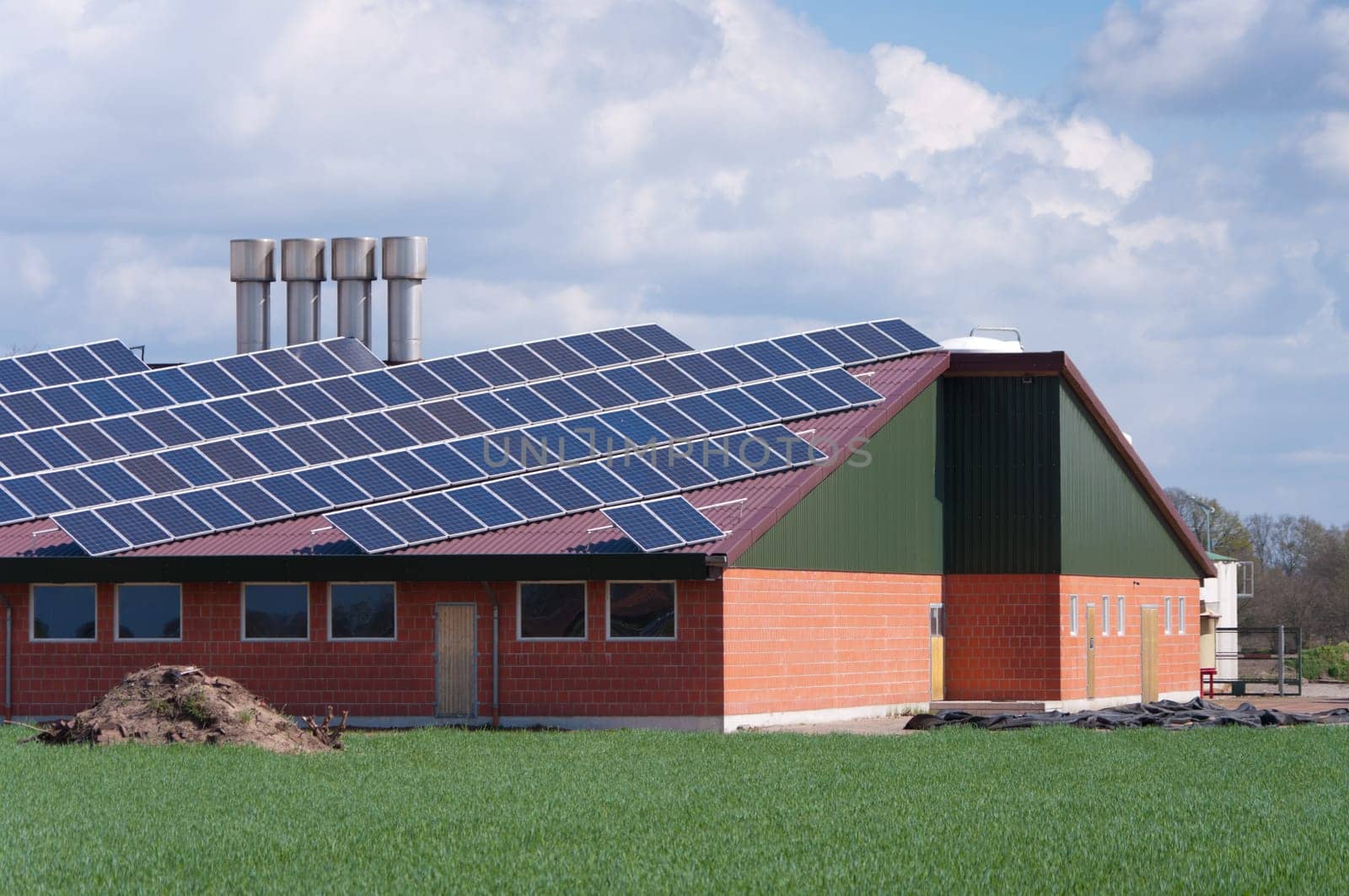 barn with its roof full with solar panels
