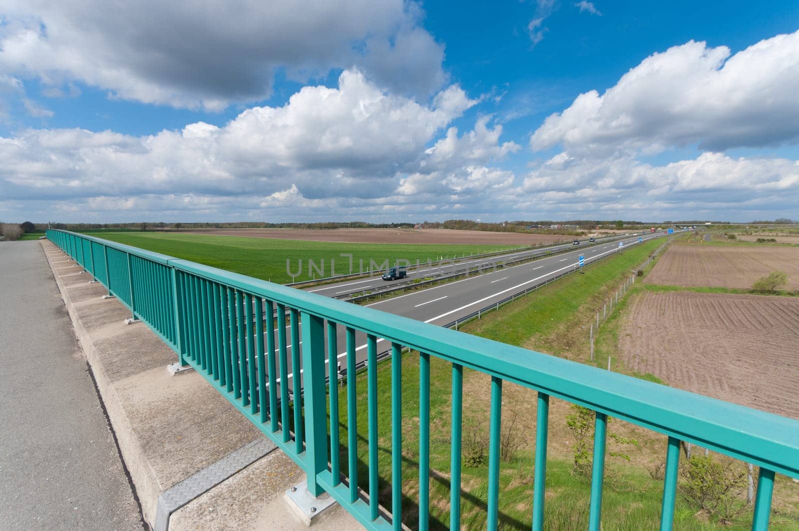 view over an autobahn somewhere in germany under a nice cloudy sky