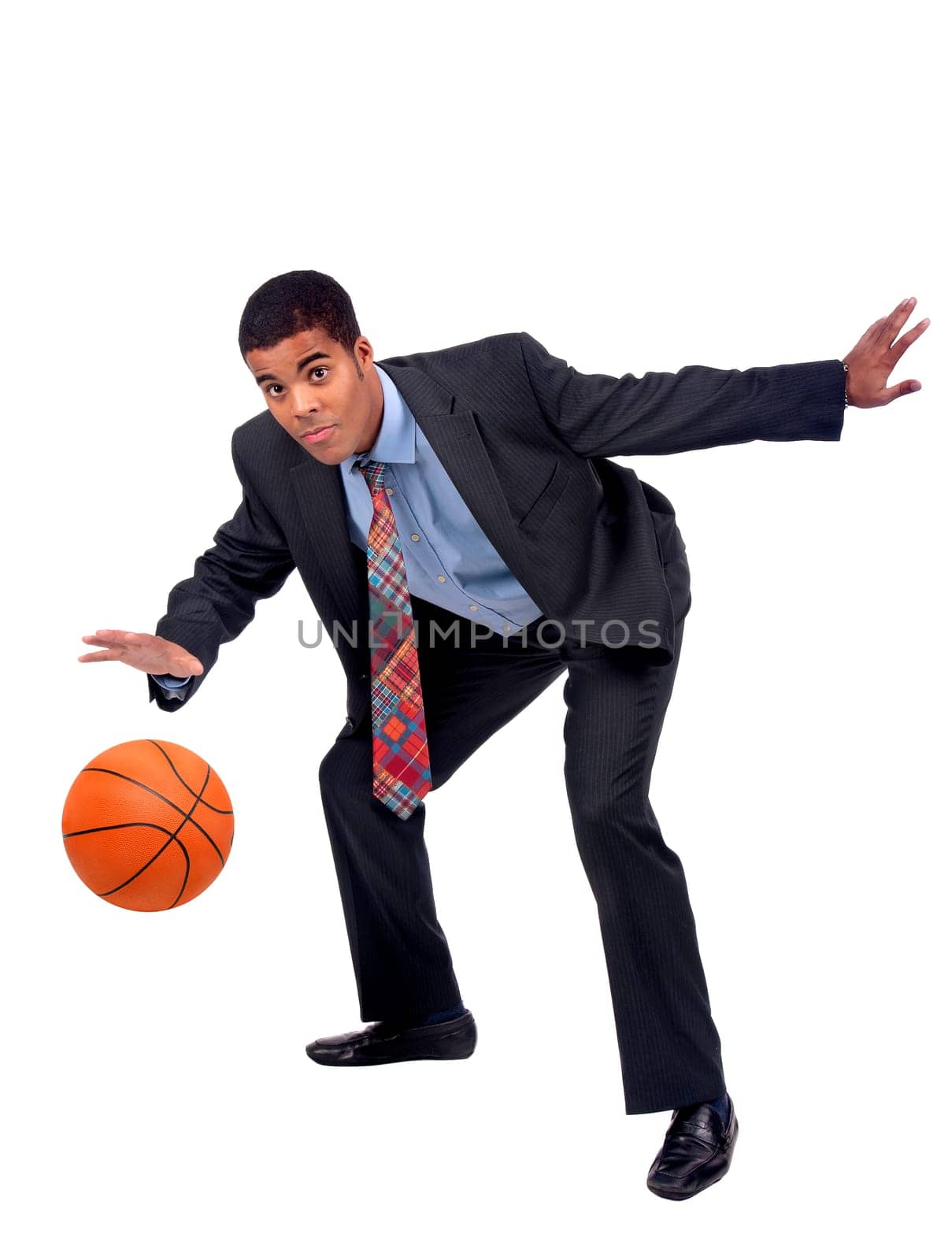 Businessman playing basket isolated in white