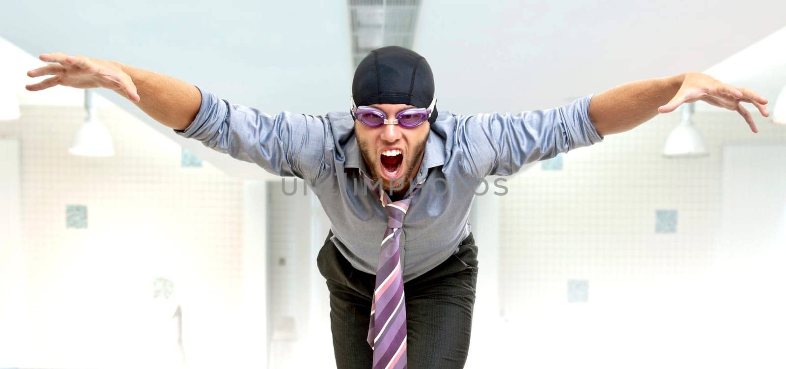 Businessman with swimming gear in a pool