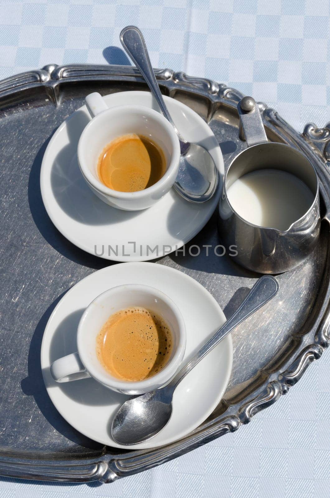 cups of coffee and milk with tray