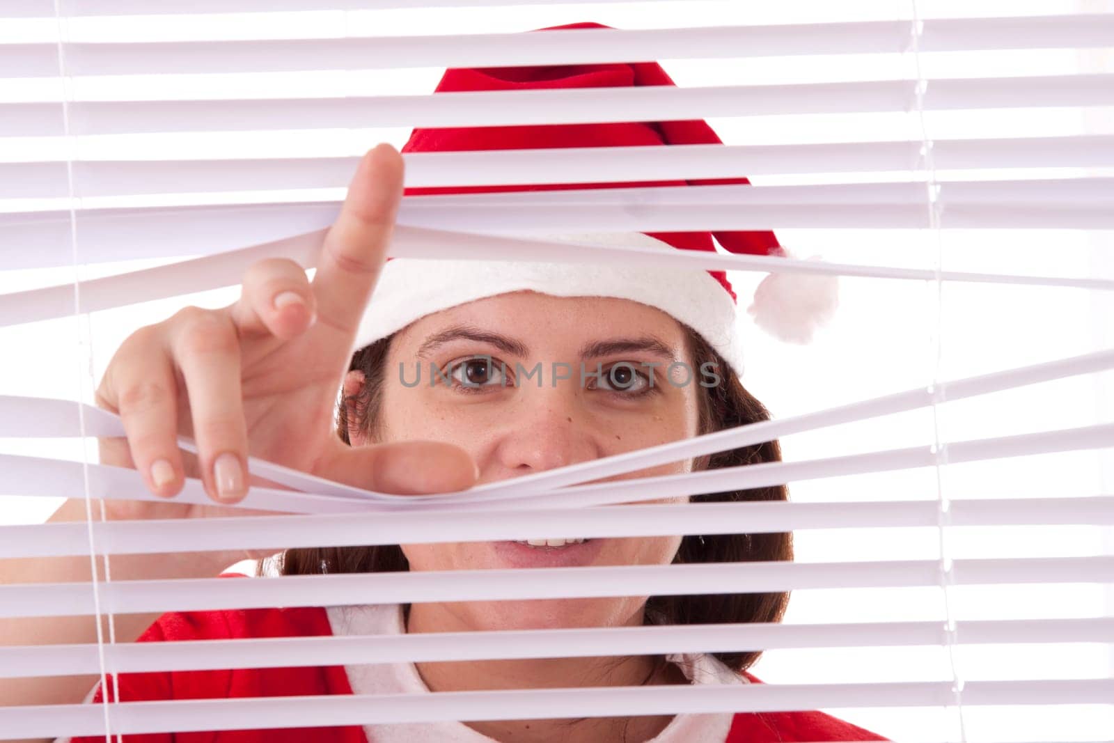 Mrs. Santa Claus hands apart on the window blinds