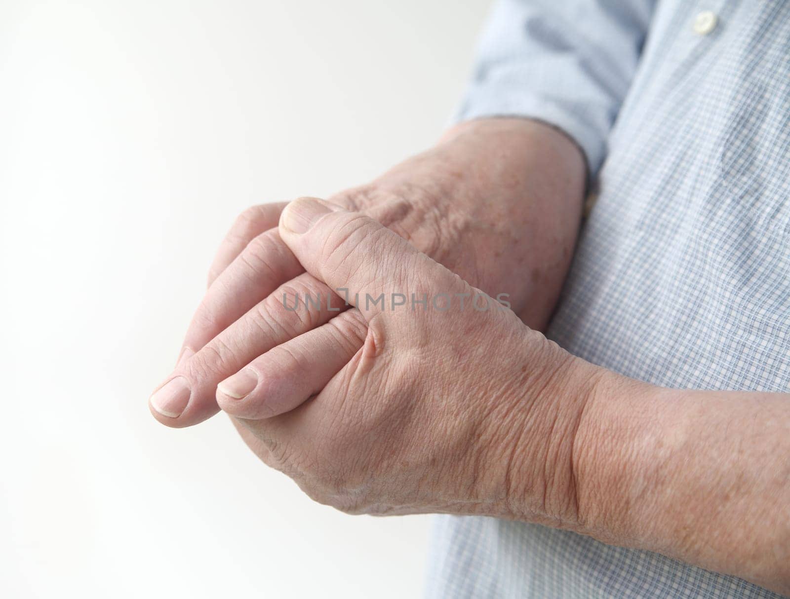 a man with painful joints on his hands