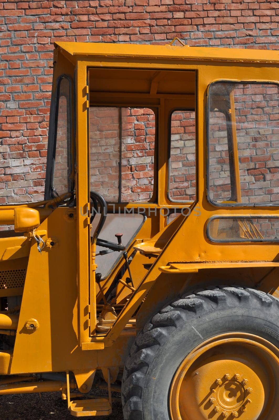 An old tractor vehicle machinery used in agriculture or construction
