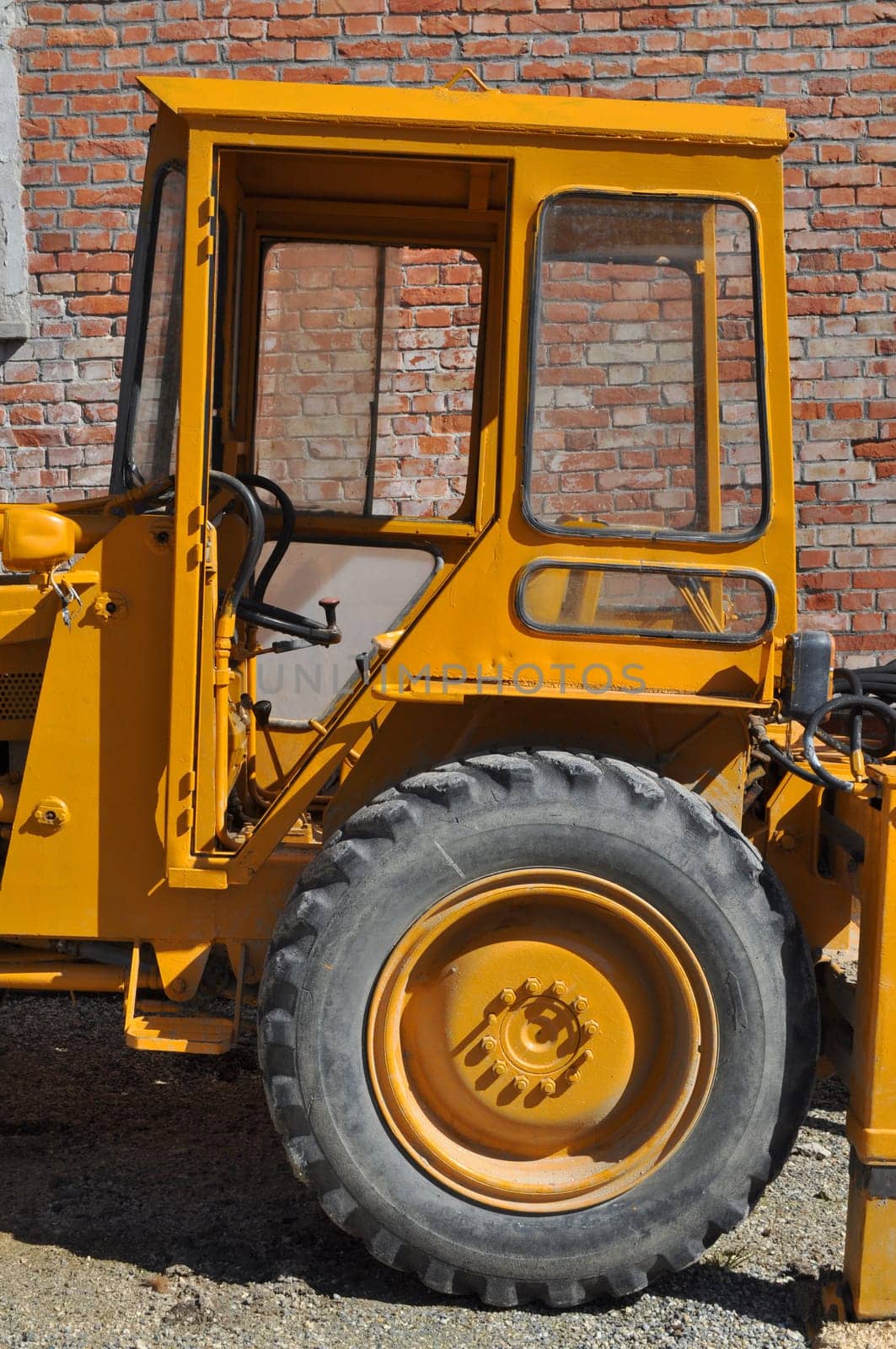 An old tractor vehicle machinery used in agriculture or construction