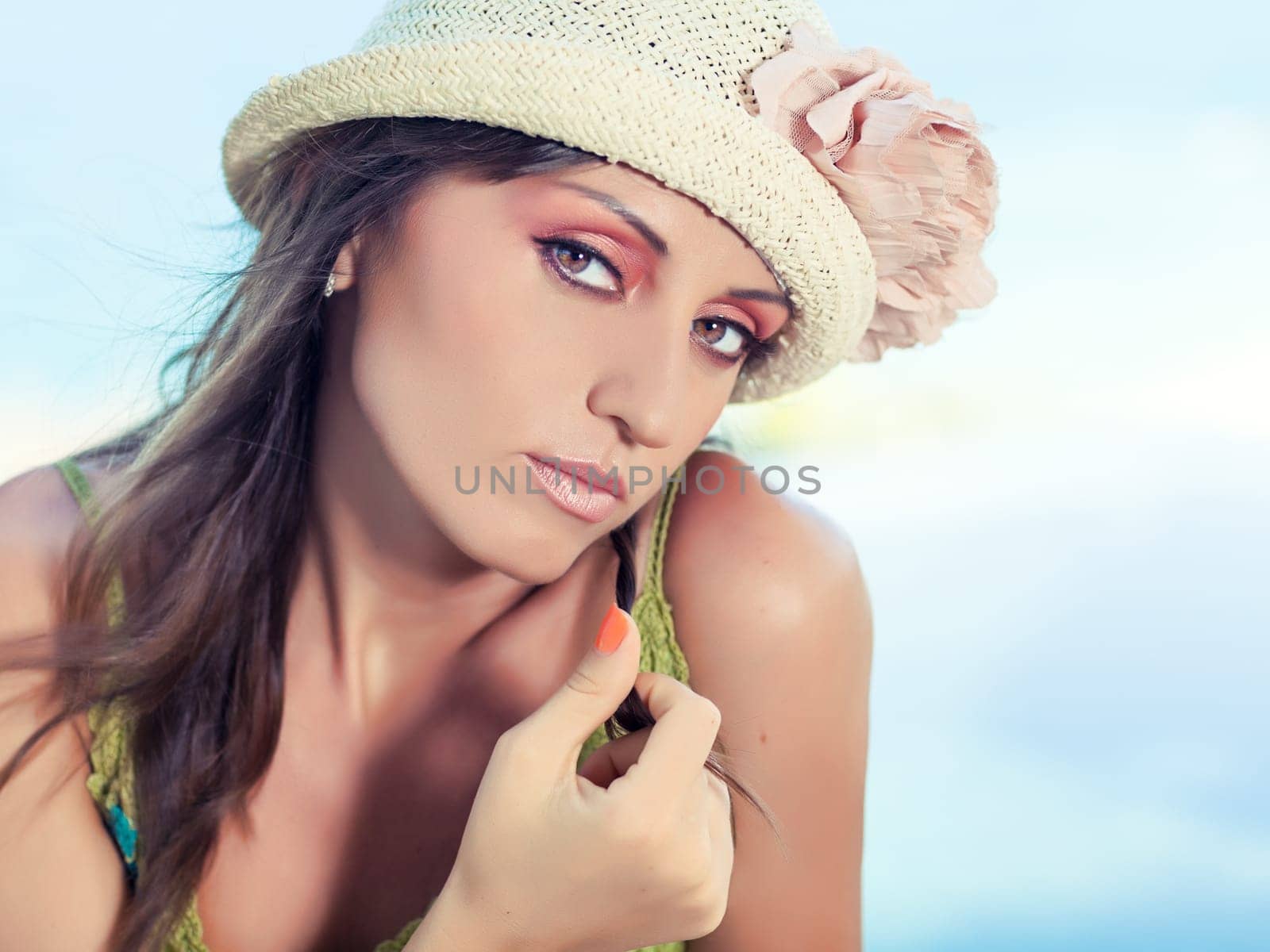 Beautiful woman in sunglasses and hat outdoor