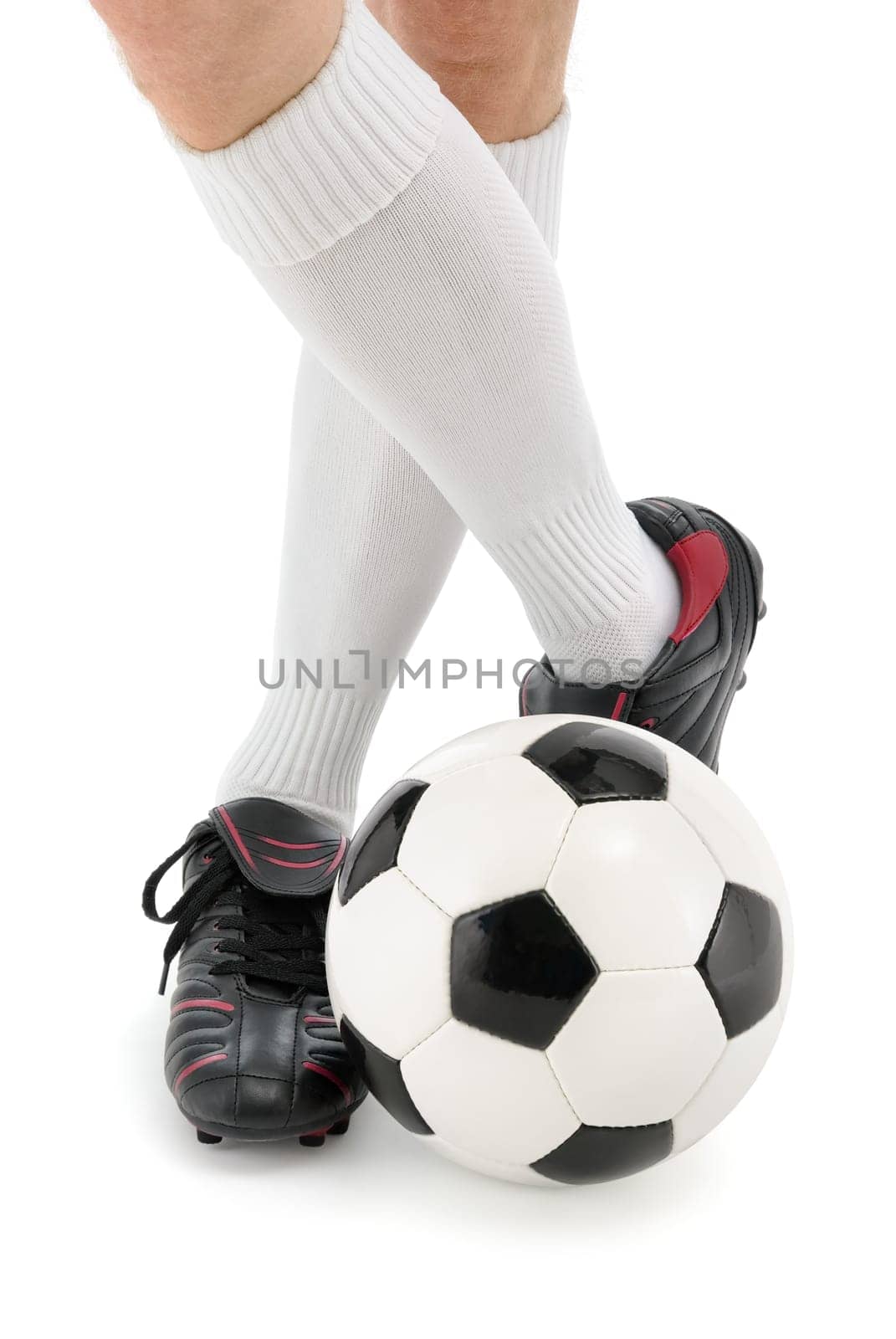 Feet of a soccer player with the ball,isolated on white