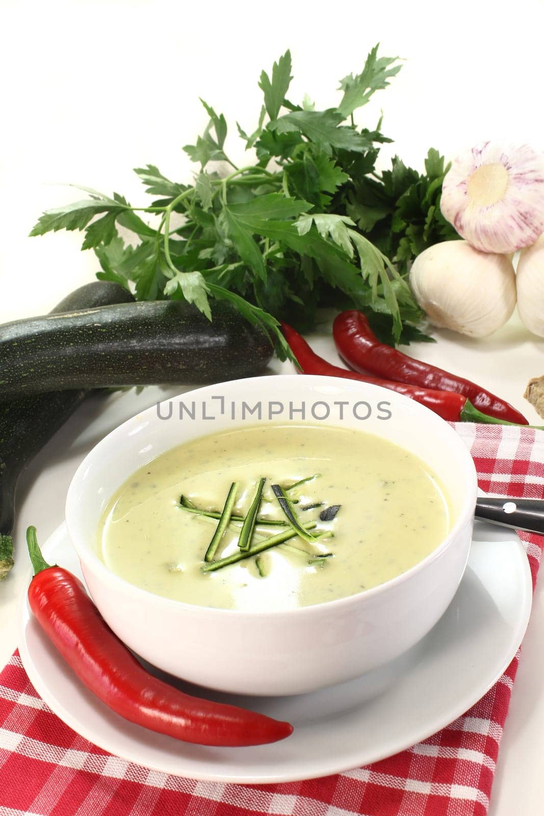 a bowl of zucchini cream soup with fresh julienne