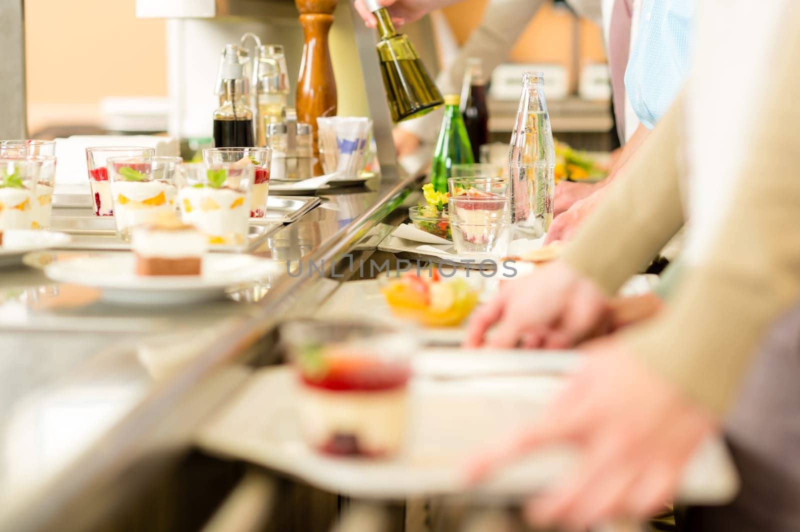 Desserts at cafeteria people with serving tray self service canteen