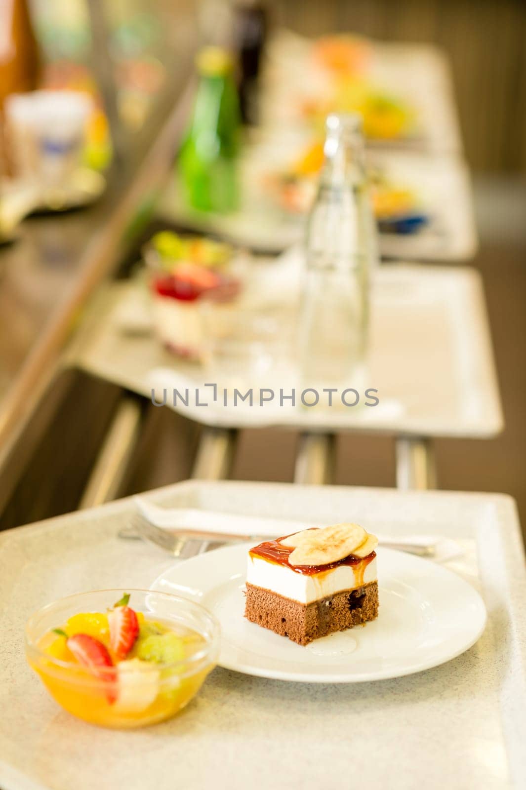 Desserts on serving tray cafeteria self service fruit salad cake