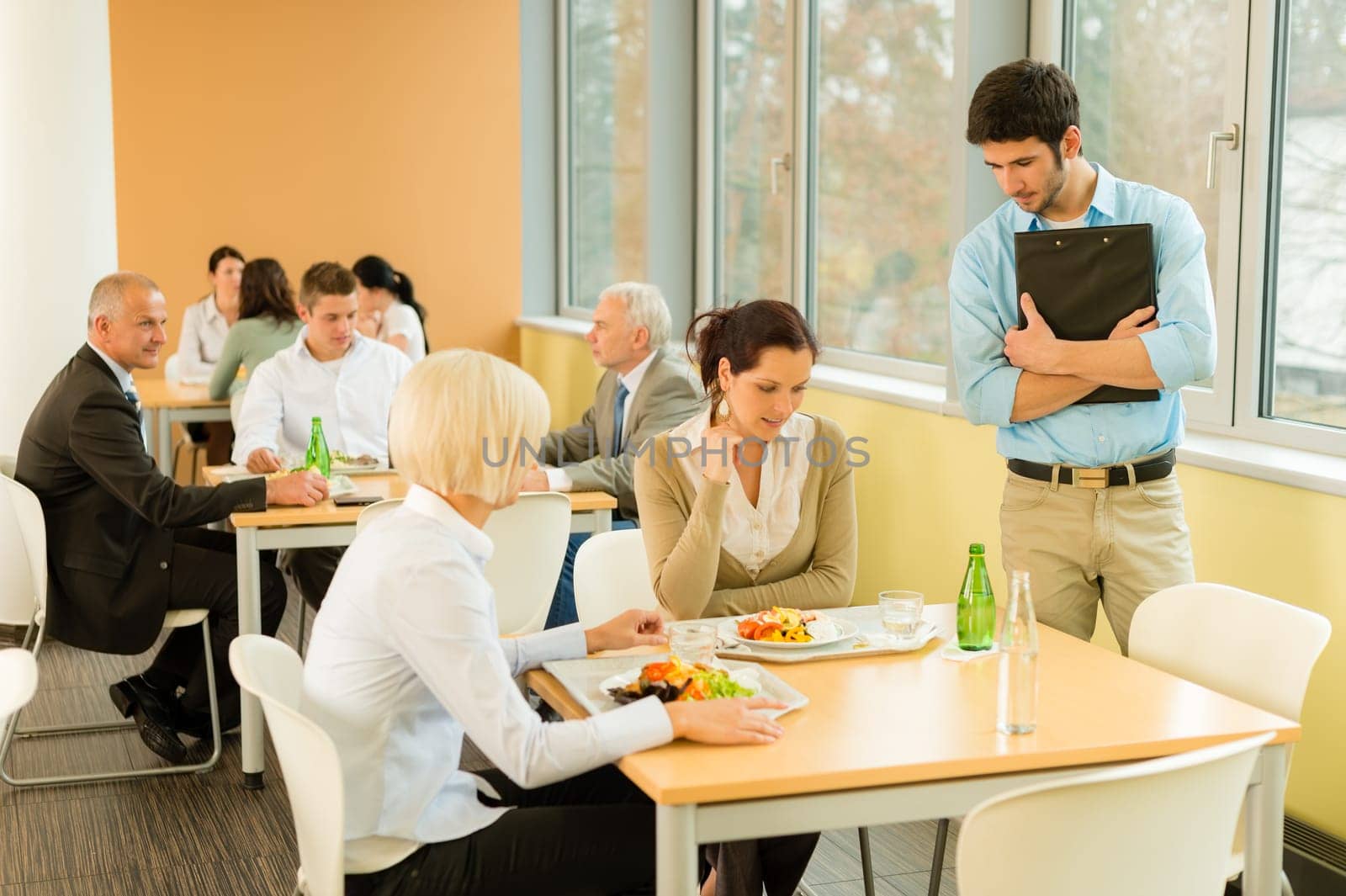Lunch break office colleagues eat meal in cafeteria fresh salad