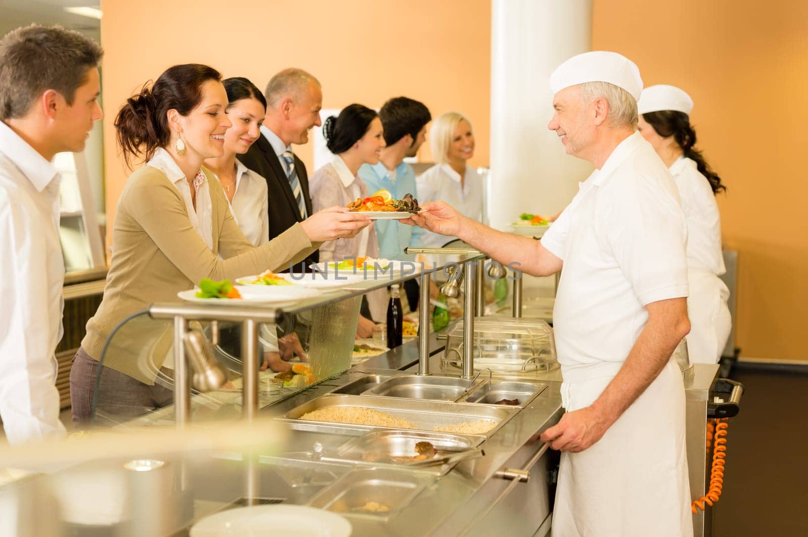 Business colleagues in cafeteria cook serve fresh healthy food meals