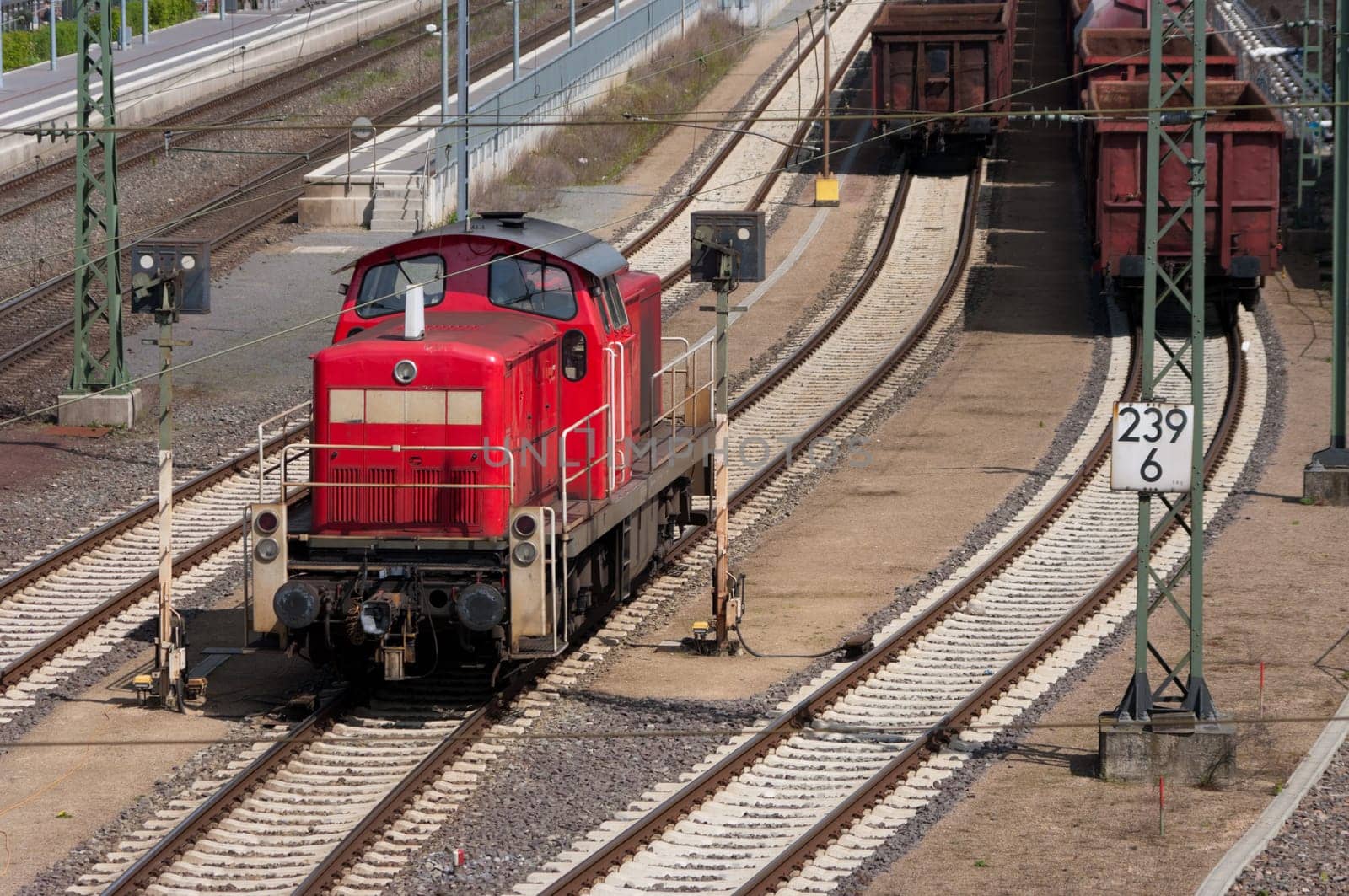 red locomotive in front of the train station in Lingen, Germany