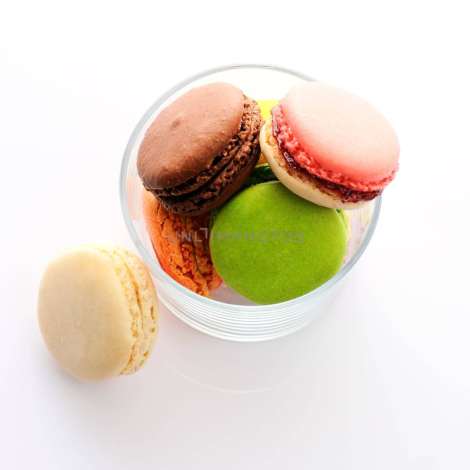 Colorful macaroons on white background