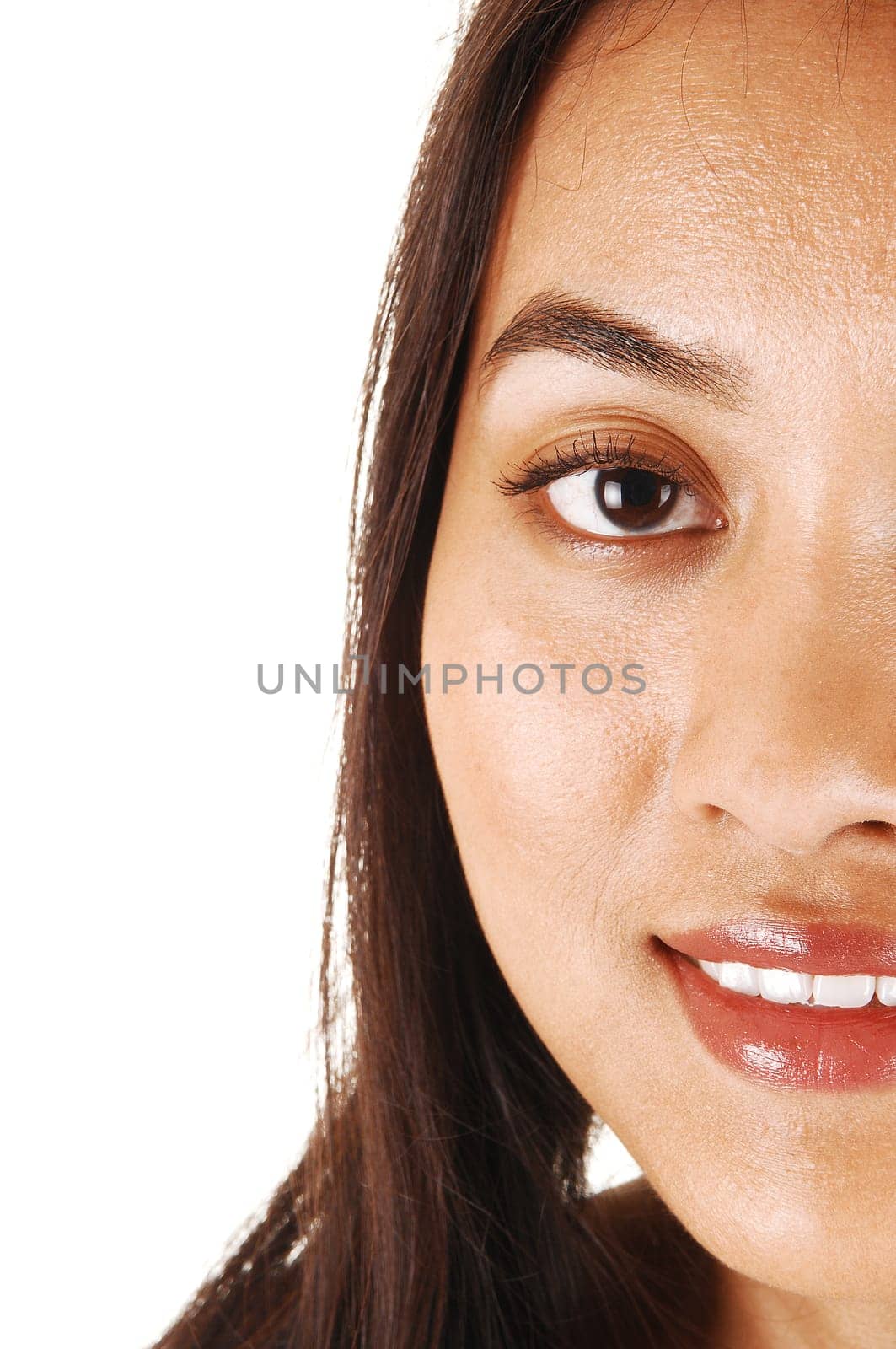 The half face of a young pretty Asian woman with long brunette hair for white background.