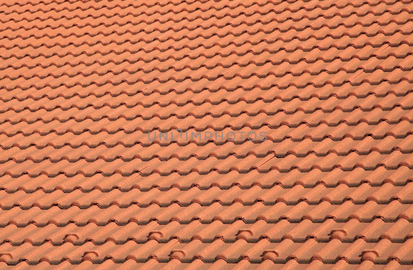 detail photo - roof made of small orange shingles,