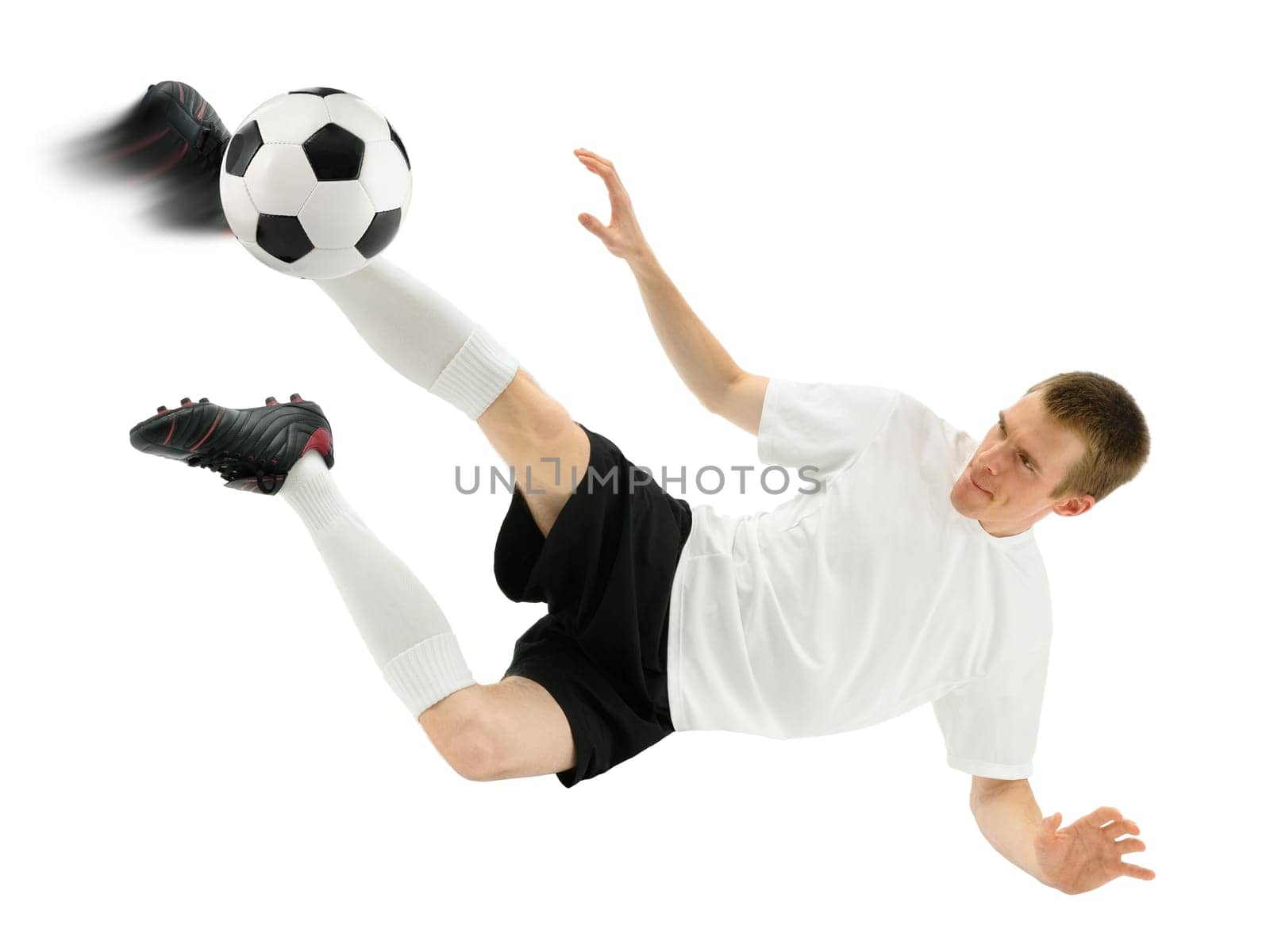 Isolated studio shot of a footballer taking a overhead kick