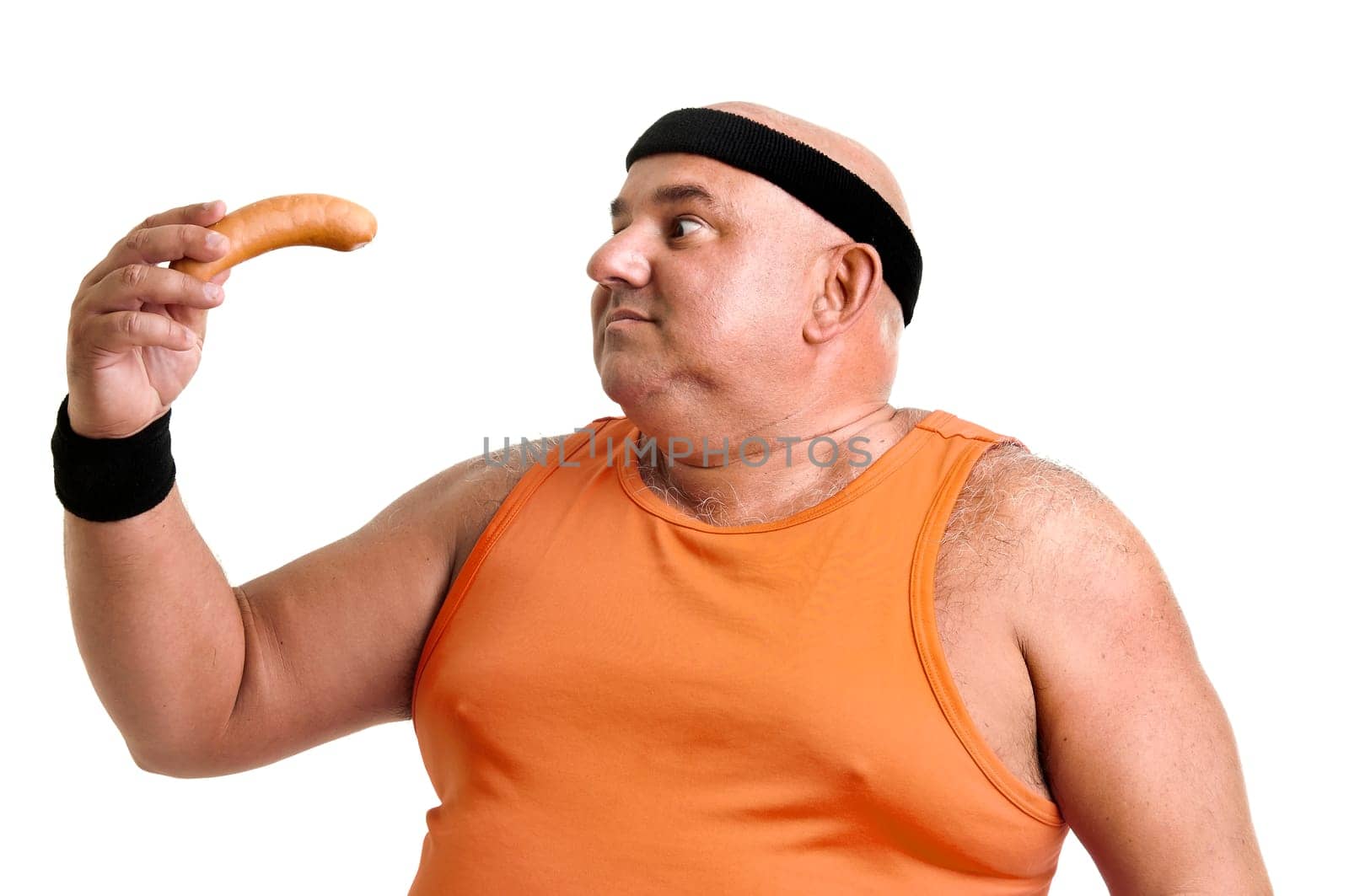 Large "fitness"" man with a big sausage isolated in white"