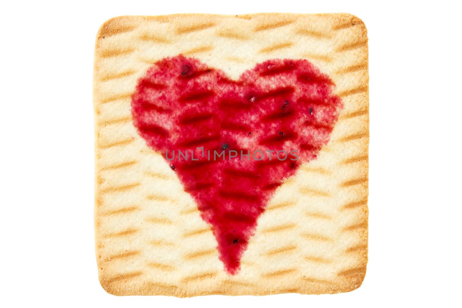 Cookie with blueberry jam in shape of heart.Isolated on white