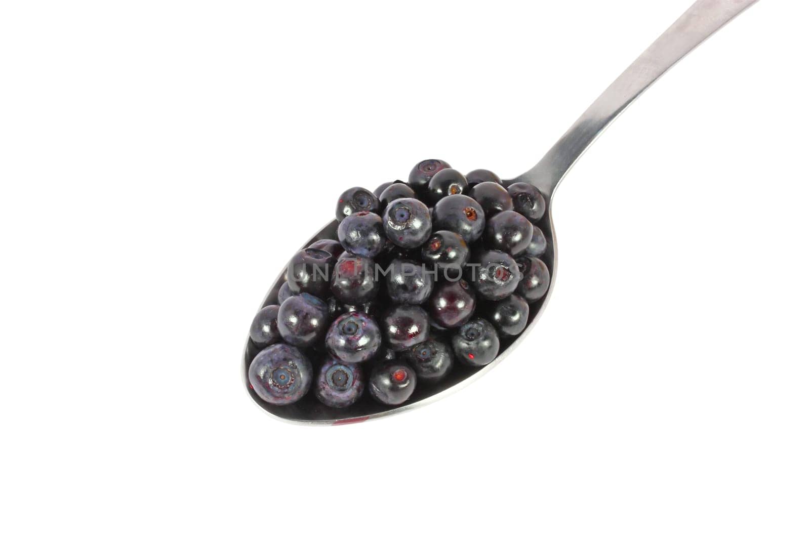 Spoon full of fresh blueberries, isolated on white