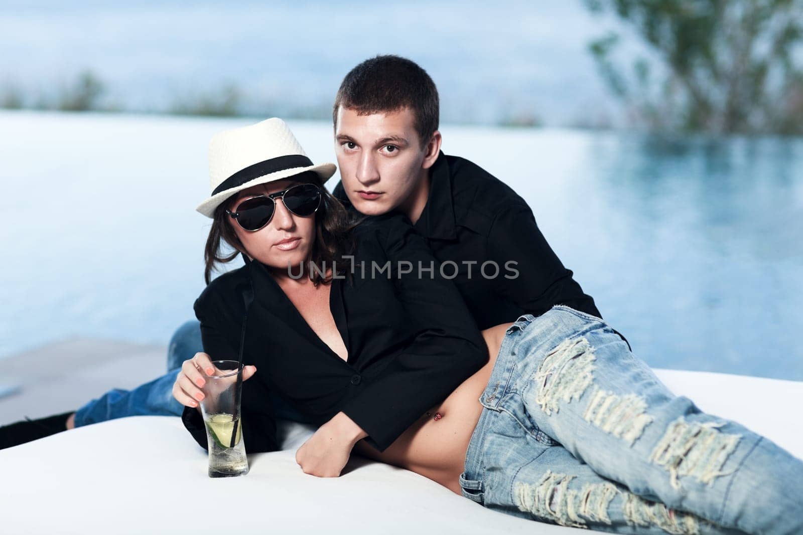 Young couple. Sea on the background