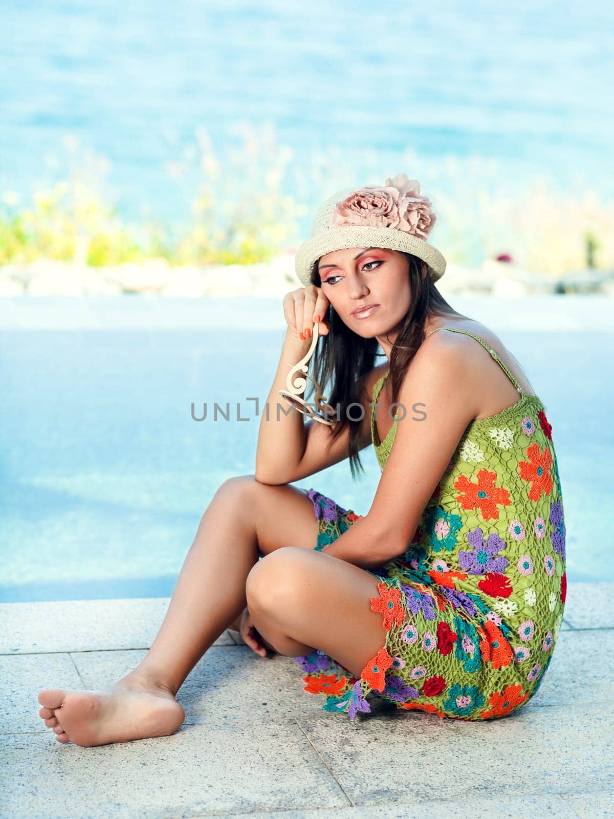 Beautiful woman in sunglasses and hat outdoor
