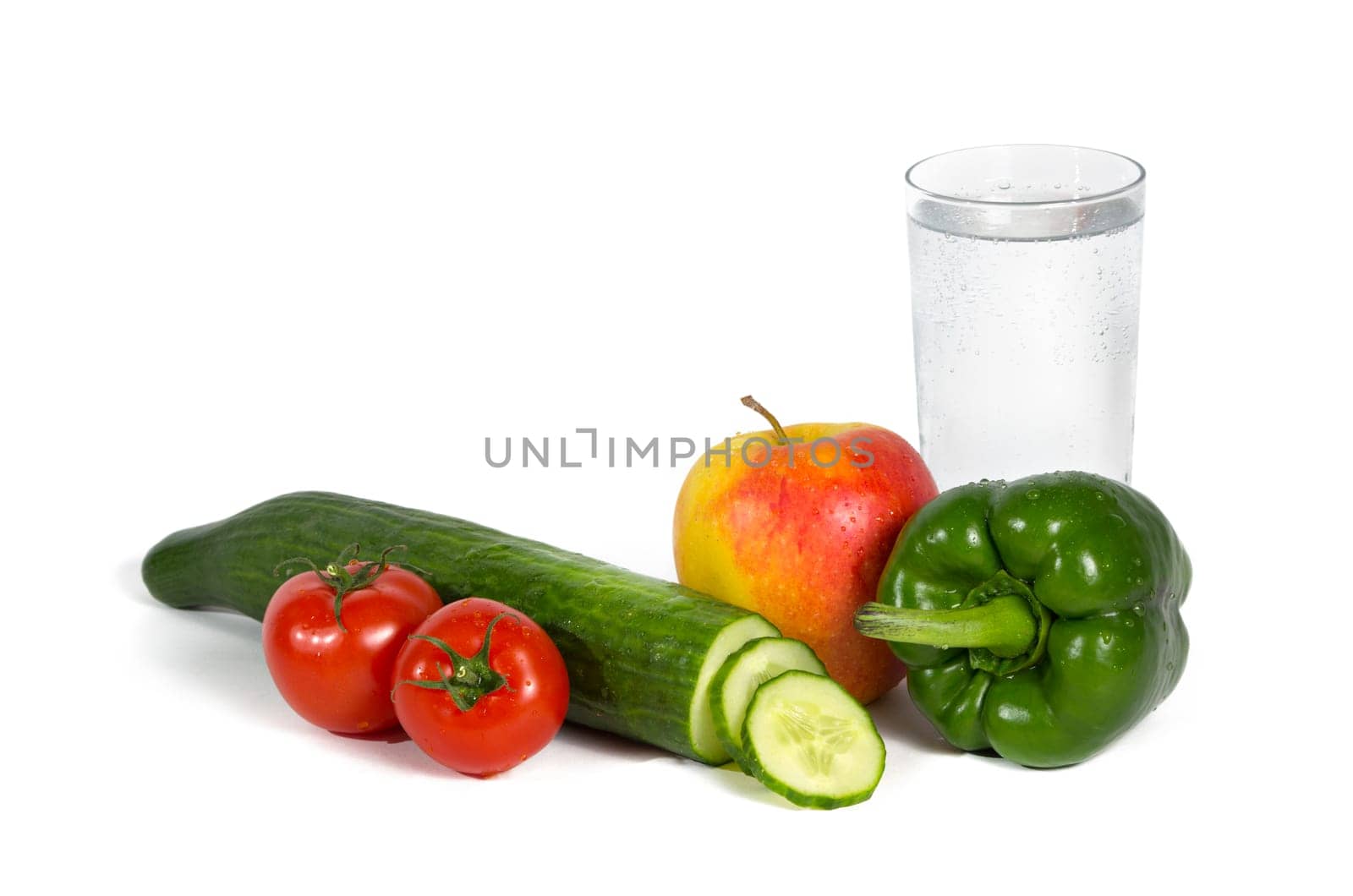 Fresh fruit and vegetables with a glass of mineral water