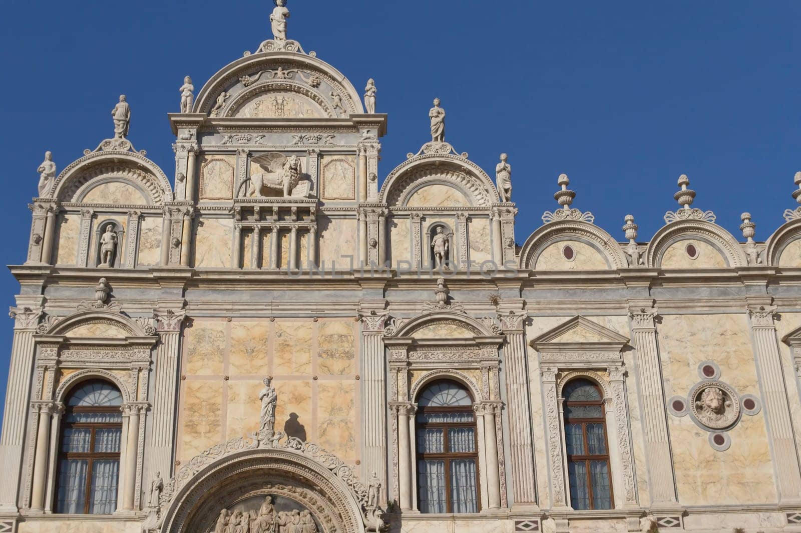 Scuola Grande di San Marco with blue sky in the background (Venice, Italy). Horizontally.