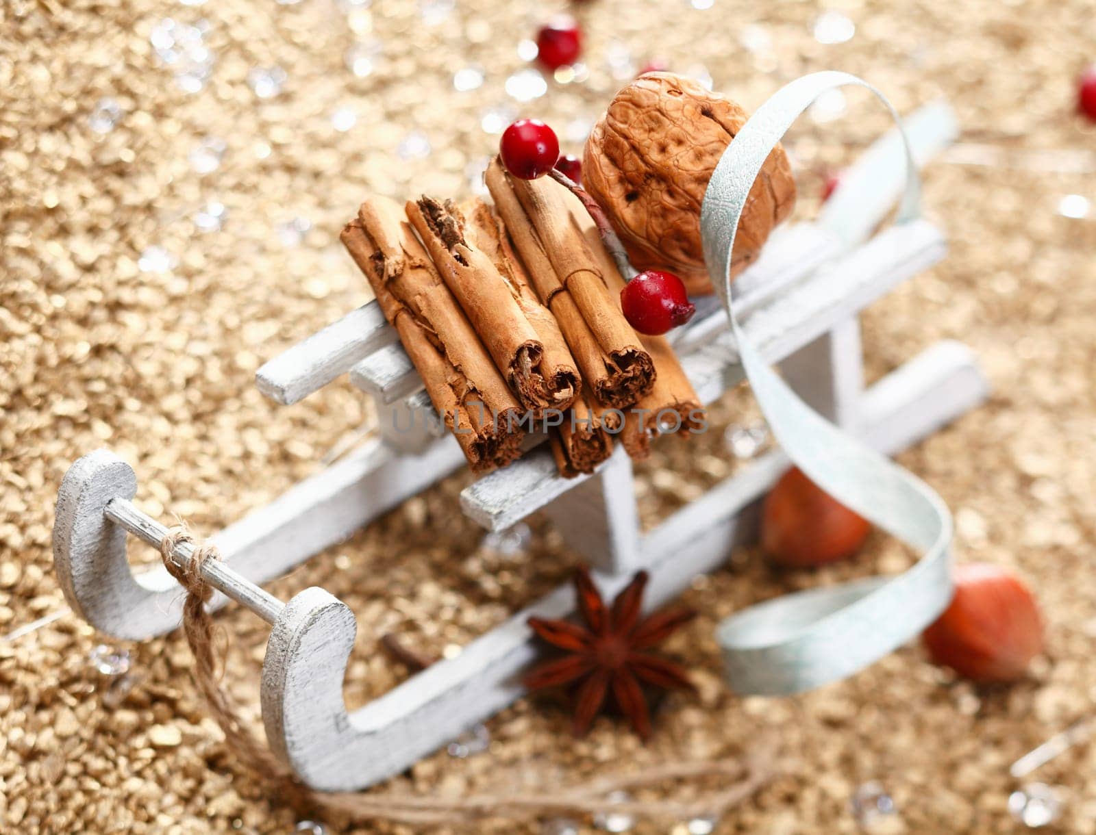 A Christmas sledge full of herbs and nuts on a festive background. Whole series in my Portfolio