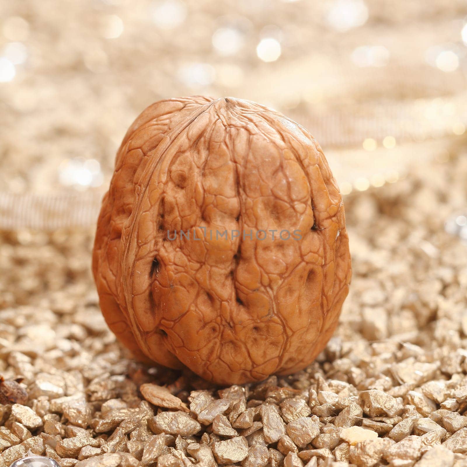 Walnut with shell on a festive background for wintery times